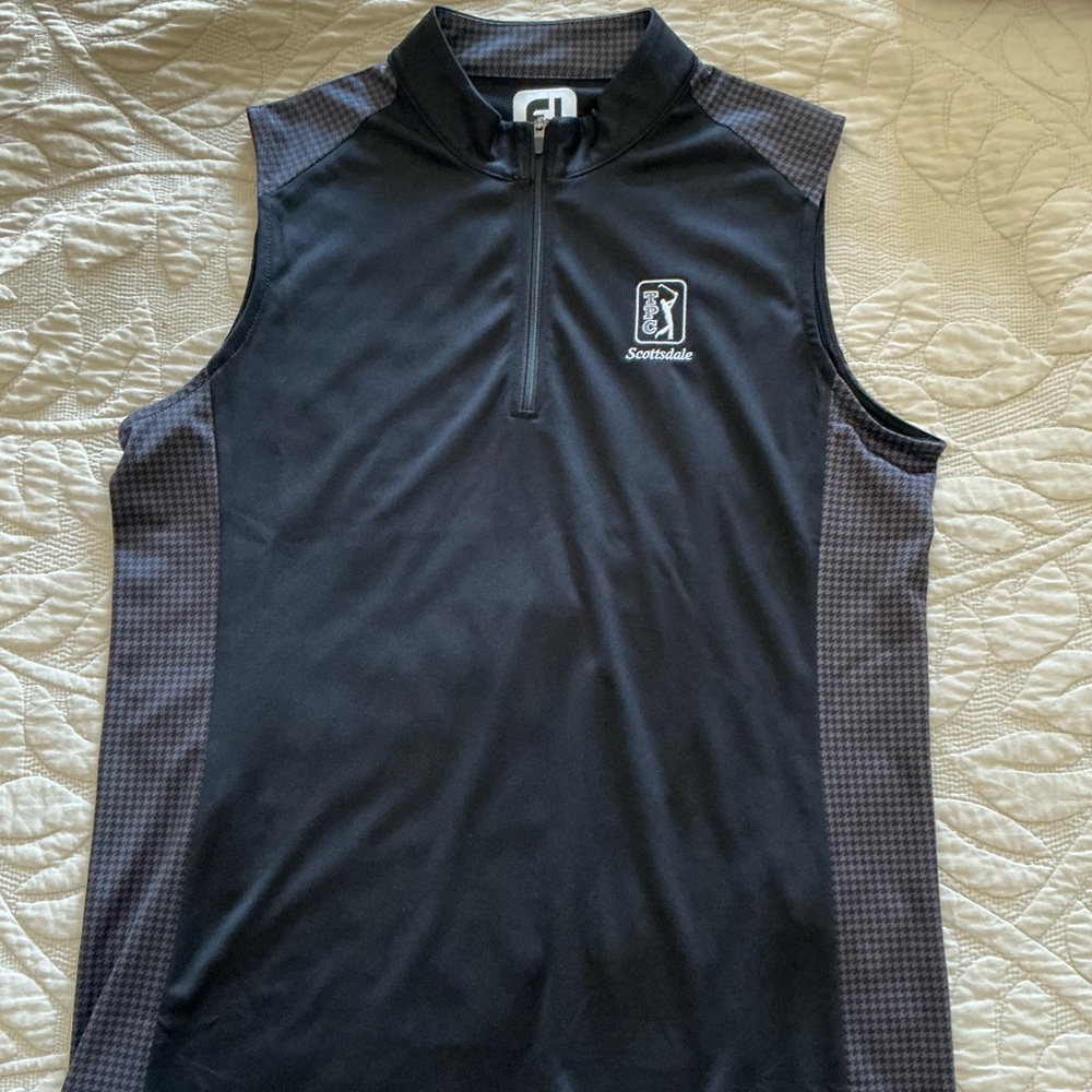 Ladies black sleeveless golf shirt
